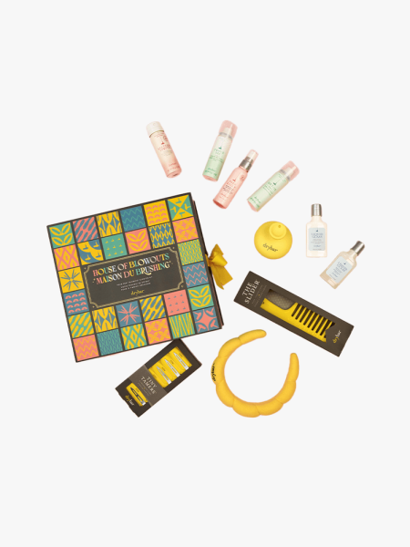 Drybar House of Blowouts Advent Calendar in branded calendar with multiple components on a light gray background