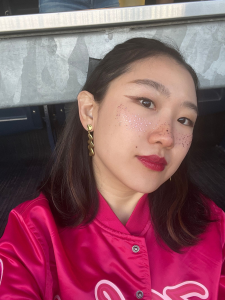 A selfie of Allure commerce editor Sarah Han wearing Fazit Rose Gold Speckles Makeup Patches