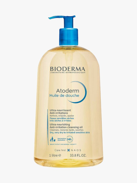 Bioderma Atoderm Shower Oil bottle of pale yellow shower oil with blue pump cap on light gray background